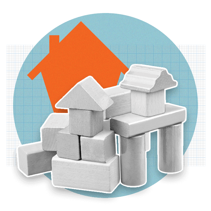 Wooden blocks stacked on each other with orange house behind the blocks