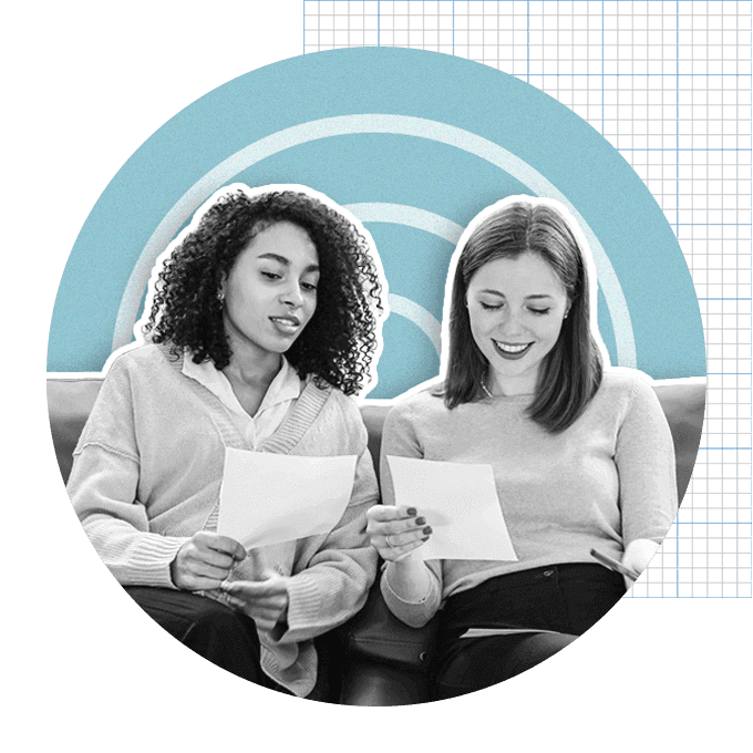 Two women looking at documents together