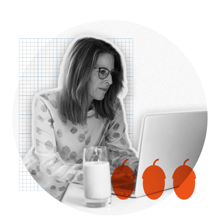 Woman wearing glasses looking at laptop