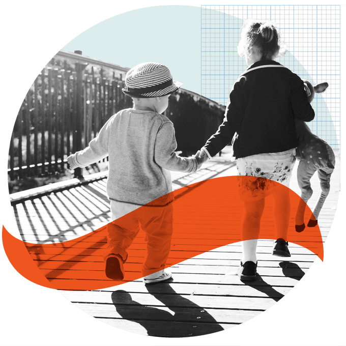 Back view of two kids running on bridge