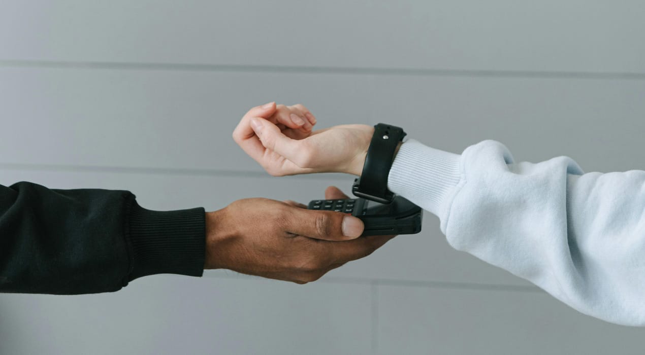 Person using their smart watch to make a 'tap and go' payment