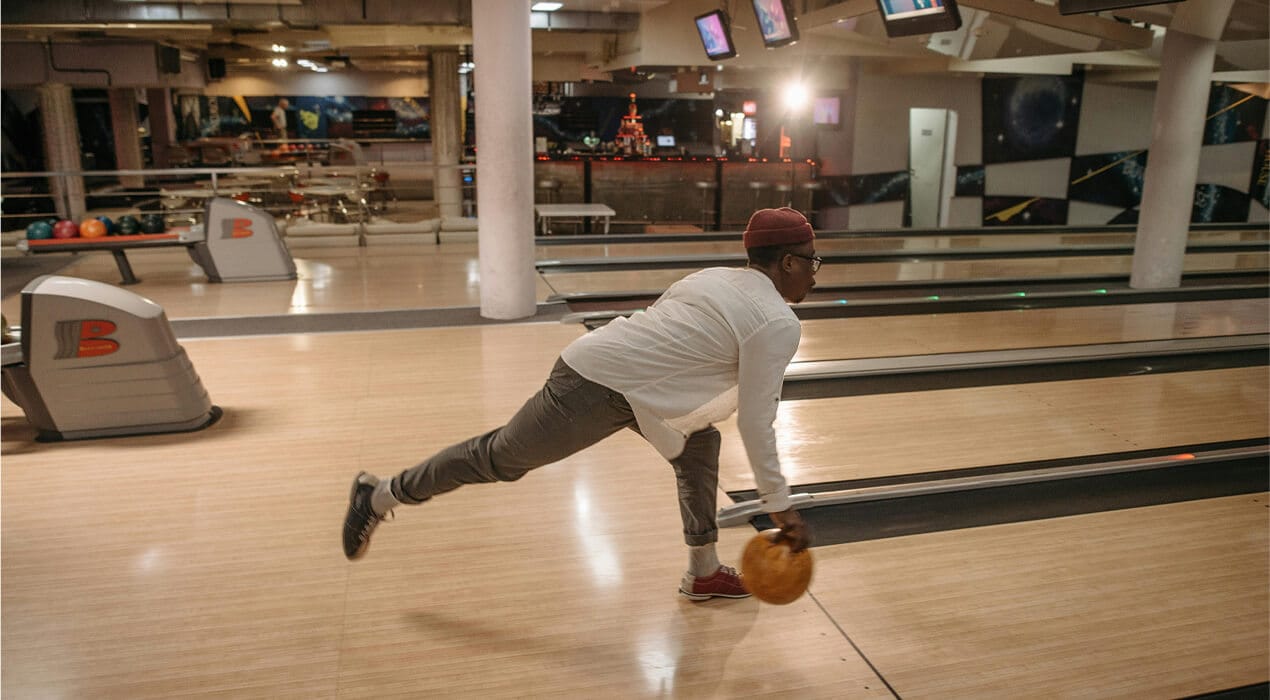 Man bowling at bowling alley